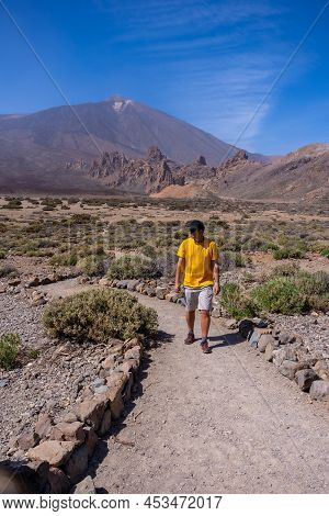 A Young Tourist On The Volcano Trekking Trail At The Llano De Ucanca Viewpoint In The Teide Natural 