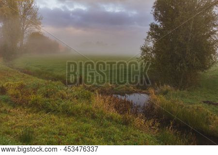 Autumn Polder Foggy Landscape Of Frisland, Netherland, Europe.
