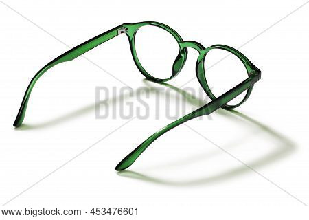 Eyeglasses In Green Bright Color In Transparent Plastic. Eyewear Rear View With Shadow. Trendy Glass