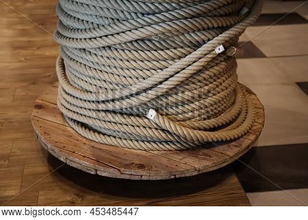 A Drum With A Coiled, Wound Rope, A Rope.