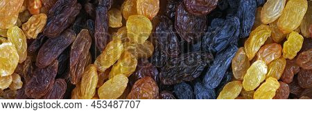 Several Different Varieties Of Raisins Are Placed In Rows Obliquely. The Texture Of Grains Of Raisin