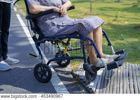 Caregiver Help And Care Asian Senior Or Elderly Old Lady Woman Patient Sitting And Happy On Wheelcha