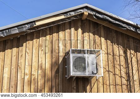 Air Conditioning On The Wall Of Wooden Cottage.modern Climate Systems