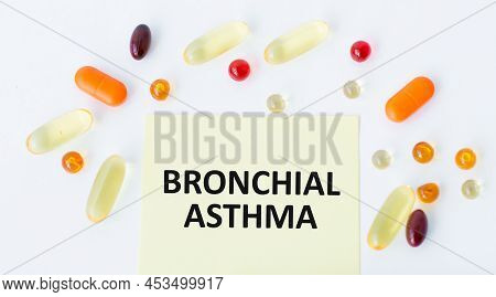 Text Bronchial Asthma On Yellow Paper Loya Notes On A White Background Next To Scattered Colored Tab