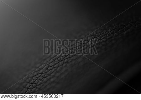 The Structure Of Dermantine Fabric Close-up. Selective Focus. Abstract Dark Background With Gradient