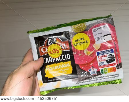 Lyon, France - Apr 25, 2022: Pov Male Hand Holding Package With Charal Carpaccio Parmesan Special Of