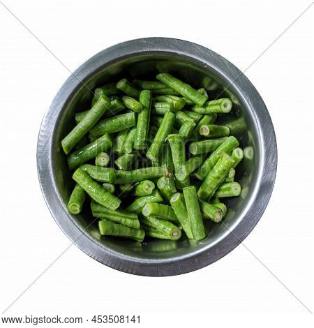 Kacang Panjang Or Yardlong Bean, Chunks Of String Beans In A Metal Container, Isolated On A White Ba