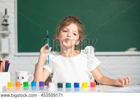Child Girl Drawing With Coloring Pens Paintind. Portrait Of Adorable Little Girl Smiling Happily Whi