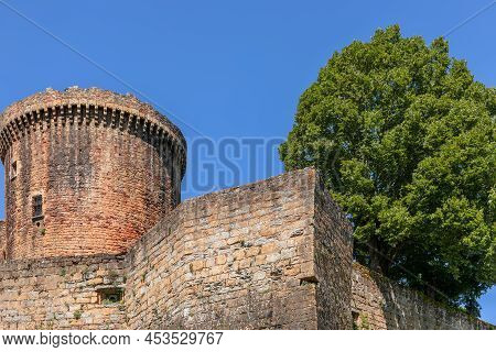 Wall Of Fortification Castle Chateau De Castelnau-bretenoux With Tower. prudhomat, France