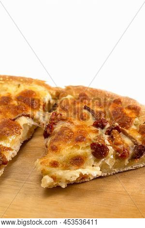 Extreme Closeup View Of Sliced Traditional Freshly Baked Cheese And Mushrooms Pizza On Woden Plate.