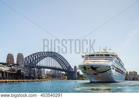 Sydney, Australia - April 19, 2022: Pacific Explorer Cruise Ship Getting Tugged From Sydney Harbour 