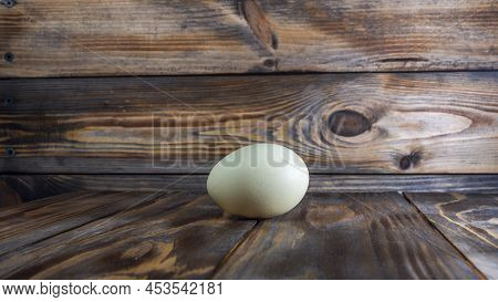 Araucana Egg On Wooden Background. Light Blue Egg From Araucana Chicken. Easter Festival Concepts. E