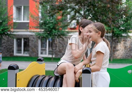 Sisterhood, Friendship. Two Charming Teen Girls Having Fun On A Modern Playground. Sister, Bffs Comm