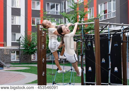 Sisterhood, Friendship. Two Charming Teen Girls Having Fun On A Modern Playground. Sister, Bffs Comm