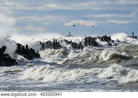Big Waves Breaking Over Harbor Breakwall Concrete Tetrapods