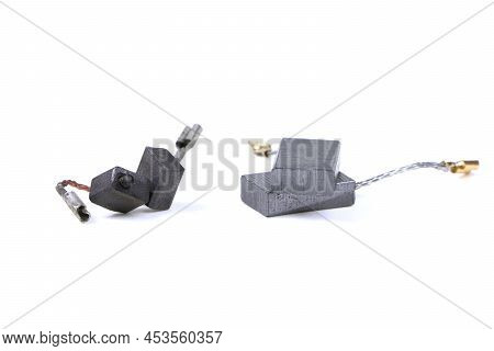 New And Old Carbon Brushes Isolated On A White Background. Brushes For Electric Motor.spare Parts Fo