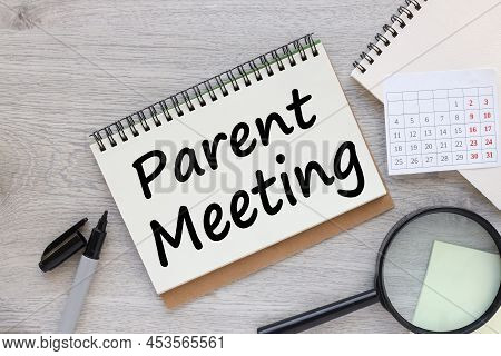 Parent Meeting. Text On A Sheet Of Notepad Paper On A Light Table
