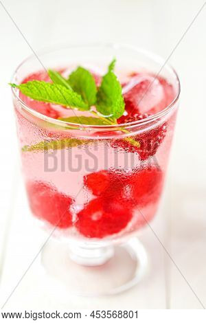 Raspberry Cocktail.summer Drink.raspberry Pink Drink.ice Cubes With Raspberries In A Glass With Wate