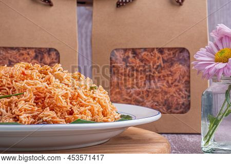 Sweet And Sour Crispy Noodles Or Mee Krob In The Thai Language On A Dish With Cloth, Vase Placed On 