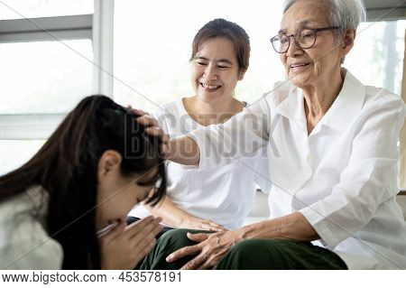 Happy Smiling Asian Senior Woman Is Stroking Her Child Girl Head, Welcoming Her Family,loving Daught