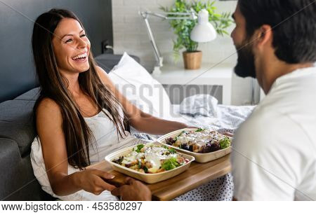 Men Brings Breakfast To Bed For His Beautiful Girlfriend. Couple, Love Concept