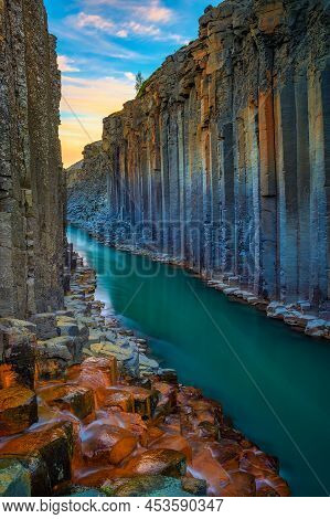 Studlagil Canyon With The Jokulsa A Bru River In East Iceland Photographed At Sunset.