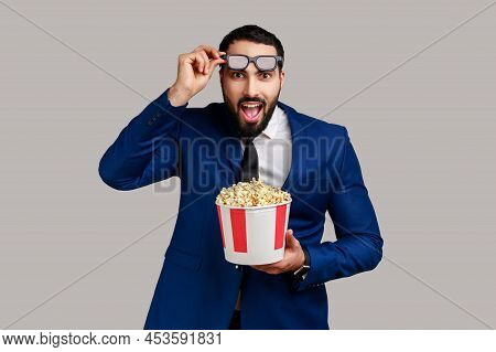 Bearded Man Being Impressed Of Movie Film, Hold Popcorn, Watching Amazing Movie, Keeping Mouth Open,