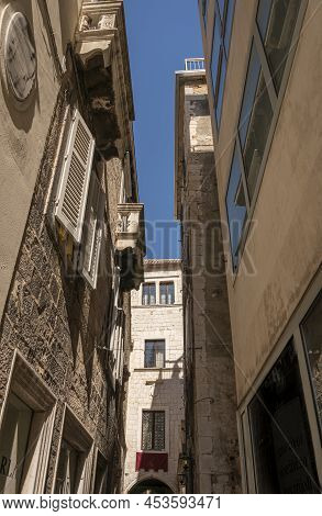 View Looking Up At Building Facades In A Narrow Alley In The Diocletian's Palace In The Ancient City