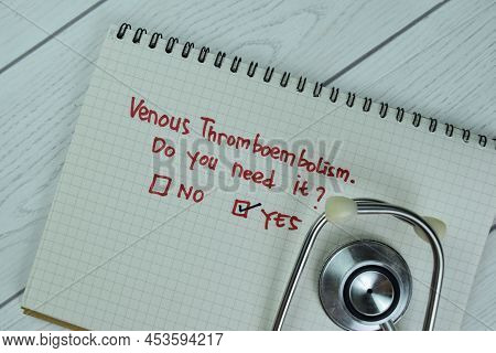 Concept Of Yes, Venous Thromboembolism Write On Sticky Notes Isolated On Wooden Table.