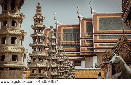 Architecture Exterior Of The Chapel With Gable Apex Roof And Chinese Stone Sculptures Against Blue S