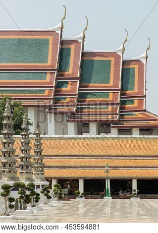 Architecture Exterior Of The Chapel With Gable Apex Roof And Chinese Stone Sculptures Against Blue S