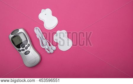 Medical Electric Acupuncture Massager In Modern Medicine. Treatment Of Body Pain And Fat Burning, Pi