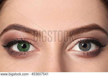 Woman With Different Colors Of Eyes, Closeup. Heterochromia Iridis
