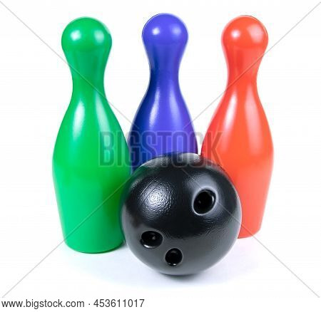 Set Of Collored Bowling Pins And Ball Isolated On A White Background. Skittles Isolated On A White B