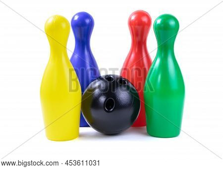 Set Of Collored Bowling Pins And Ball Isolated On A White Background. Skittles Isolated On A White B