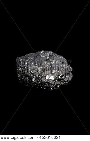The Pyrite, Known As Fool's Gold, A Mineral Stone On Black Background.