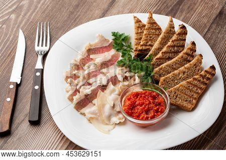 Raw Chopped Pork Lard With Meat, A Head Of Garlic And Rye Bread On A Wooden Background For Copy Spac