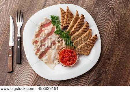 Raw Chopped Pork Lard With Meat, A Head Of Garlic And Rye Bread On A Wooden Background For Copy Spac