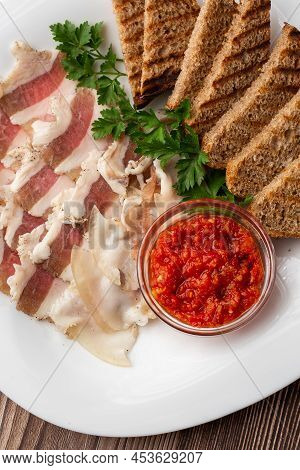 Raw Chopped Pork Lard With Meat, A Head Of Garlic And Rye Bread On A Wooden Background For Copy Spac