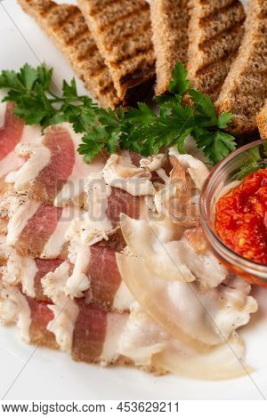 Raw Chopped Pork Lard With Meat, A Head Of Garlic And Rye Bread On A Wooden Background For Copy Spac