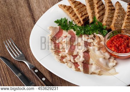 Raw Chopped Pork Lard With Meat, A Head Of Garlic And Rye Bread On A Wooden Background For Copy Spac