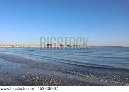 Dam Of The Sottomarina Town In Northern Italy And The Wooden Building With Nets Fishing Called Trabu