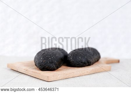 Black Long John Buns Bread With Copy Space For Text