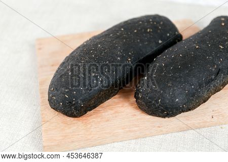 Black Long John Buns Bread With Copy Space For Text