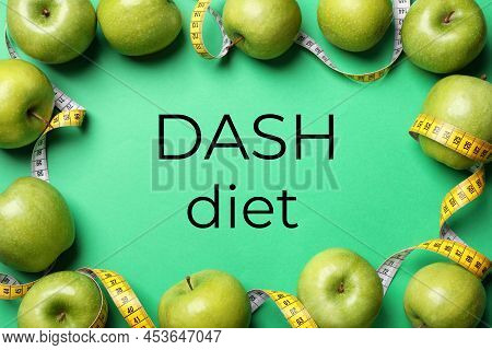 Dash Diet To Stop Hypertension. Ripe Apples And Measuring Tape On Green Background, Flat Lay