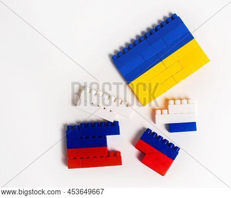War Between Ukraine And Russia. Concept In The Form Of A Constructor With The Colors Of National Fla