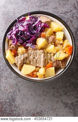 Scouse Is A Slow Lamb Stew With Potatoes, Turnips, Onions And Carrots Close-up In A Plate On The Tab