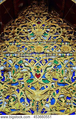 Sculpture And Carving Ancient Antique Art On Roof Of Traditional Temple Ordination Halls Or Old Ubos