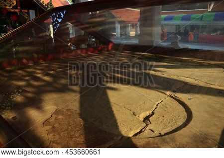 Ancient Ruin Antique Old Footprint Of Buddha In Wat Si Khom Kham Temple For Thai People And Foreign 
