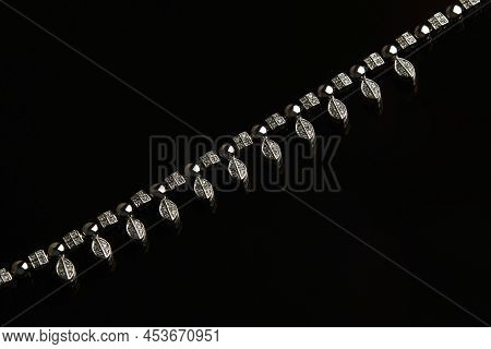 Necklace With Diamonds On Black Background With Copy Space